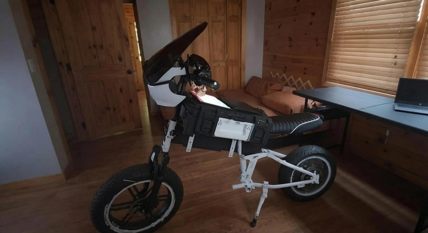 Design iteration two — white folding chassis with modular pack and windscreen