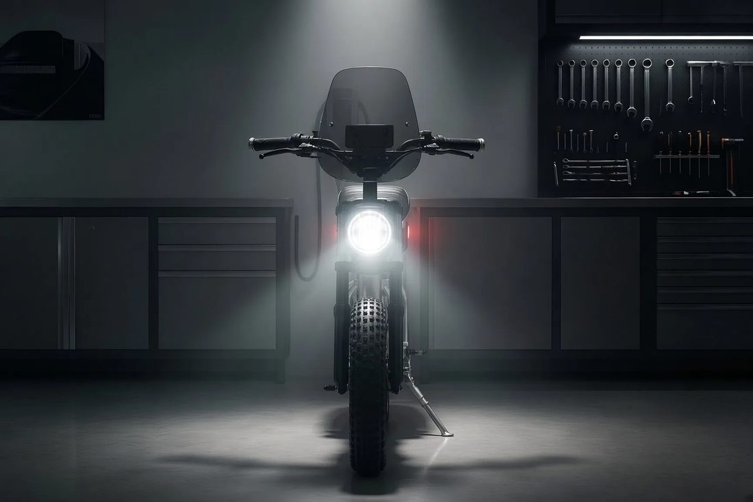 Puca folding electric motorcycle, left front workshop view